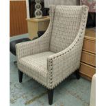 ANDREW MARTIN LIBRARY CHAIR, 70cm x 116cm H, in a patterned linen fabric with studded detail.