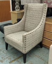 ANDREW MARTIN LIBRARY CHAIR, 70cm x 116cm H, in a patterned linen fabric with studded detail.