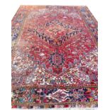 ANTIQUE PERSIAN HERIZ CARPET, 330cm x 240cm.