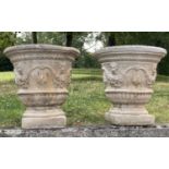 PLANTERS, a pair, 51cm diam. x 52cm H, weathered reconstituted stone, of neo Classical form, with