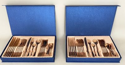 CANTEEN CUTLERY SETS, a pair, each with four place settings, coppered metal, blue cases, 5cm x