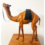 CAMEL, 60cm H, vintage leather figure of a saddled camel.