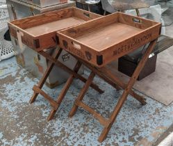 DRINKS TRAY TABLES, a pair, stamped with various champagne houses, 65cm x 44.5cm x 78.5cm. (2)