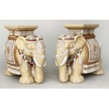 ELEPHANT STANDS, a pair, 44cm H, cream and white ceramic, in Caparison attire. (2)