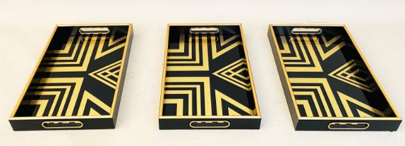 COCKTAIL TRAYS, 5cm high, 40cm wide, 25cm deep, Art Deco style gold geometric designs. (3)