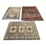 ANTIQUE RUGS, a collection of three, largest 200cm x 136cm. (3)
