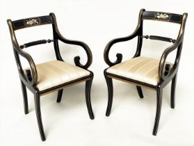 ARMCHAIRS, a pair, Regency style lacquered and gilt lined with music trophy centre and scroll