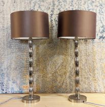 TABLE LAMPS, a pair, polished metal, with shades, 65cm H. (2)