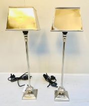LIBRARY TABLE LAMPS, 59cm high, a pair, polished metal.