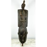 AFRICAN MASK, 'Plank Crest Mask', hand carved wood with central lizard detail and bird finial, 106cm