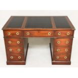 CAMPAIGN STYLE DESK, mahogany and brass bound with leather writing surface and nine drawers, 123cm x