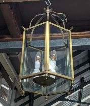 HALL LANTERNS, a set of three, gilt metal and glazed, each three branch 65cm H, each lanterns. (3)