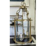 HALL LANTERN, 71cm high, 37cm diameter, gilt metal and curved glass.