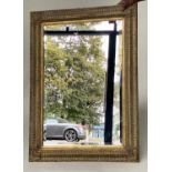 WALL MIRROR, Italian style giltwood with beveled mirror and cushion frame, 114cm H x 83cm W .