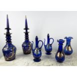 BOHEMIAN DECANTERS, a pair, blue glass with gilt decoration and stoppers, two shaped lipped vases