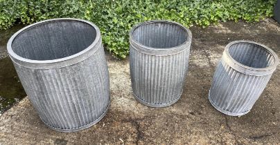 PLANTERS, a graduated set of three, galvanised metal, 50cm x 45cm x 45cm at largest.