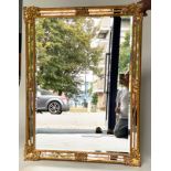 WALL MIRROR, Continental giltwood with bevelled plate, stepped marginal plates and foliate