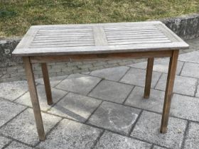 GARDEN TABLE BY LISTER, 65cm D x 109cm W x 73cm H, weathered teak, of slatted construction.