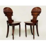 HALL CHAIRS, a pair, Regency mahogany with 'balloon' reeded and 'C' scroll backs, panel seats and