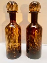 DECANTERS, a pair, 53cm H x 14cm diam., Murano style tortoiseshell glass. (2)