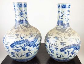 BOTTLES VASES, a pair, Chinese Export style blue and white ceramic, 60cm H. (2)
