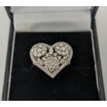 AN 18CT WHITE GOLD DIAMOND DRESS RING, the head in the form of a heart, encrusted with round