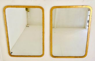 WALL MIRRORS, a pair, 96cm H x 68cm W, aged gilt metal frames. (2)