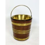 PEAT BUCKET, Georgian brass bound mahogany with brass liner and swing handle, 34cm H x 30cm diam.