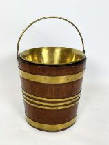 PEAT BUCKET, Georgian brass bound mahogany with brass liner and swing handle, 34cm H x 30cm diam.