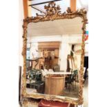 WALL MIRROR, 170cm H x 122cm mid Victorian giltwood and gesso with Rococo manner foliate decorated