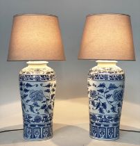 TABLE LAMPS, a pairs, Chinese blue and white ceramic of lidded vase form, with shades, 75cm H. (2)