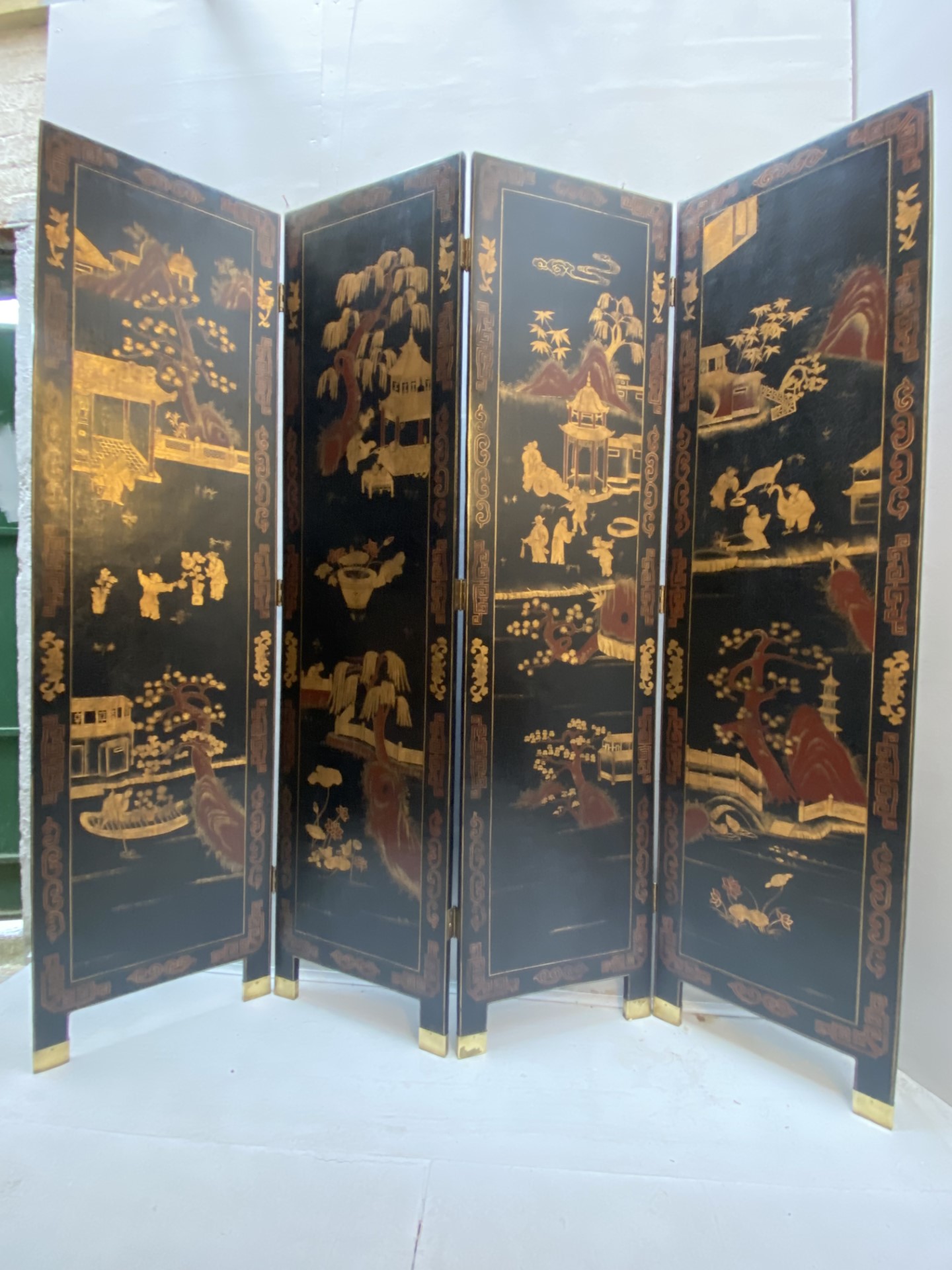 CHINESE ROOM SCREEN, early 20th century, four-sectioned, Chinoiserie iron red and gilt decoration on