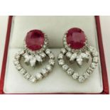 A PAIR OF 18CT WHITE GOLD RUBY AND DIAMOND EARRINGS, each set with a single natural oval mixed cut