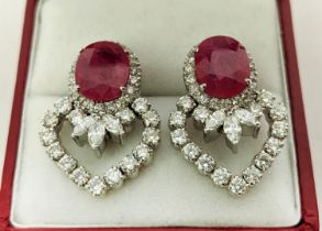 A PAIR OF 18CT WHITE GOLD RUBY AND DIAMOND EARRINGS, each set with a single natural oval mixed cut