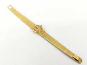 A LONGINES 18CT GOLD LADIES WRISTWATCH, serial number '15989626', gold face, original snake-link