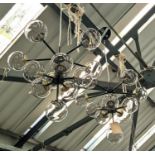 CHANDELIERS, a pair, 1950s Italian style, each 11 branch, black painted metal frame with gilt