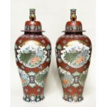 TEMPLE JARS, a pair, very large Chinese ceramic vases with covers, hand decorated polychrome