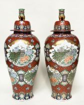 TEMPLE JARS, a pair, very large Chinese ceramic vases with covers, hand decorated polychrome