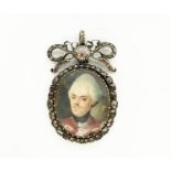 A LATE 18TH CENTURY GILT METAL PORTRAIT MINIATURE PENDANT, diamond encrusted surround set with