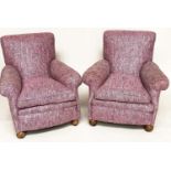 ARMCHAIRS, a pair, Edwardian with scroll arms and back, feather filled cushions and bun supports,