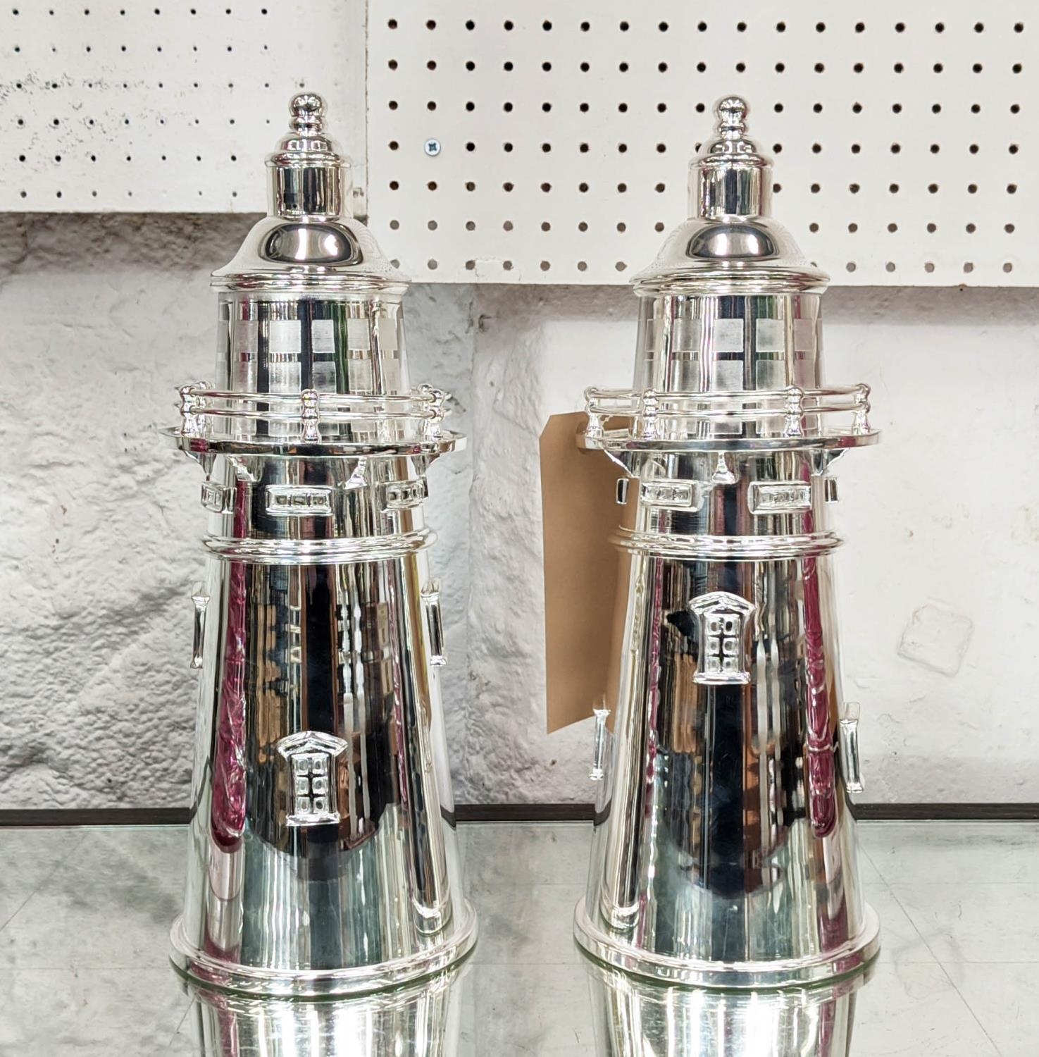 LIGHT HOUSE COCKTAIL SHAKERS, a pair, polished metal, 35cm H. (2)