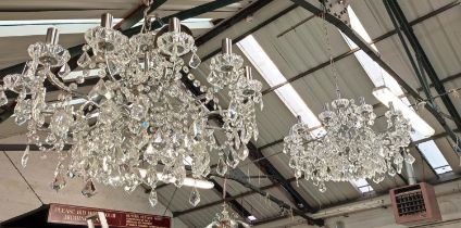 CHANDELIERS, a pair, each 12 branch, polished metal frame, 55cm drop each approx. not including