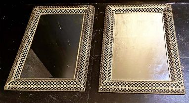 WALL MIRRORS, a pair, gilt metal pierced frames, Regency style design, 100cm x 70cm. (2)