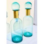 MURANO STYLE GLASS DECANTERS, 52cm high, 16cm diameter, a pair, turquoise glass with gilt