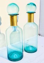 MURANO STYLE GLASS DECANTERS, 52cm high, 16cm diameter, a pair, turquoise glass with gilt