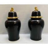 TEMPLE JARS WITH COVERS, 82cm high, 39cm diameter, black glazed ceramic, gilt detail. (2)