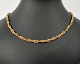 AN 18CT GOLD INTERTWINED ROPE AND DISK LINK NECKLACE, 70cm long, 32.96 grams.