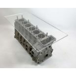 JAGUAR A526/A526 FOUR LITRE ENGINE BLOCK TABLE, with raised rectangular acrylic top, 90cm L x 45cm W
