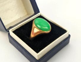 A YELLOW METAL JADE CABOUCHON SET DRESS RING, probably 18ct gold, ring size M, 8.4 grams.