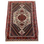 ANTIQUE PERSIAN BAKKTIARI RUG, 200cm x 140cm.